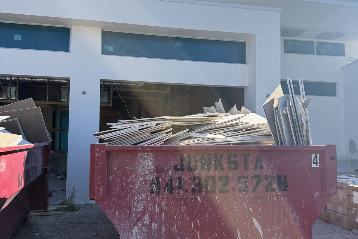 Red Junksta roll-off dumpster delivered in Lakewood Ranch, FL